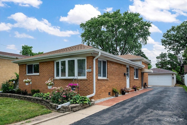 409 N Addison Rd, Villa Park, IL 60181 - view of front of property with brick siding, an outbuilding, a garage, and roof with shingles