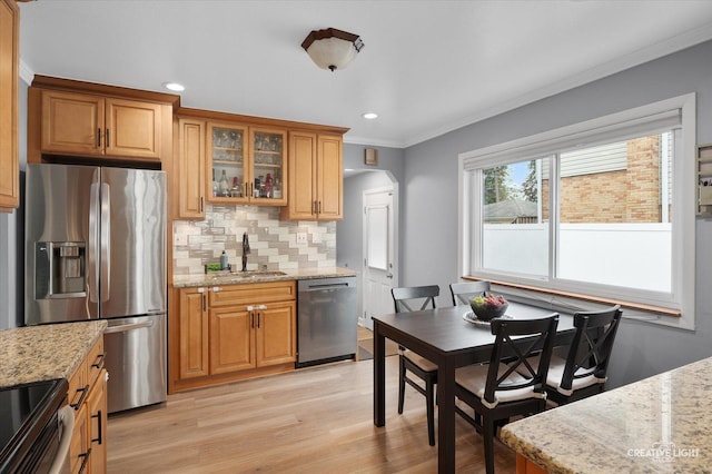 409 N Addison Rd, Villa Park, IL 60181 - kitchen featuring stainless steel appliances, light wood-style flooring, decorative backsplash, light stone counters, and glass insert cabinets