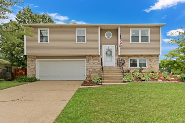 513 White Birch Rd, Lindenhurst, IL 60046 - raised ranch featuring brick siding, an attached garage, a front lawn, concrete driveway, and entry steps