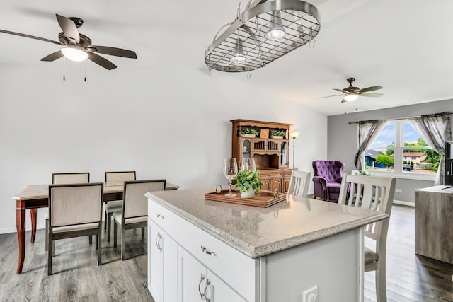 513 White Birch Rd, Lindenhurst, IL 60046 - kitchen featuring a ceiling fan, light wood-type flooring, a kitchen island, and white cabinets