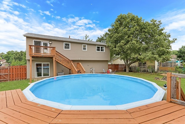 513 White Birch Rd, Lindenhurst, IL 60046 - view of pool with a wooden deck, a fenced backyard, and stairs
