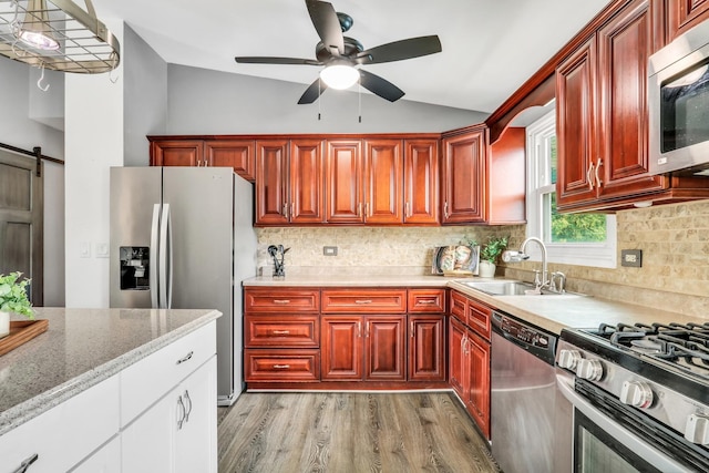 513 White Birch Rd, Lindenhurst, IL 60046 - kitchen with appliances with stainless steel finishes, vaulted ceiling, light wood finished floors, ceiling fan, and decorative backsplash