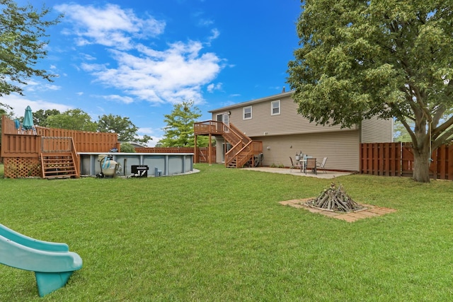 513 White Birch Rd, Lindenhurst, IL 60046 - fenced backyard with stairs, a deck, an outdoor pool, and a patio area