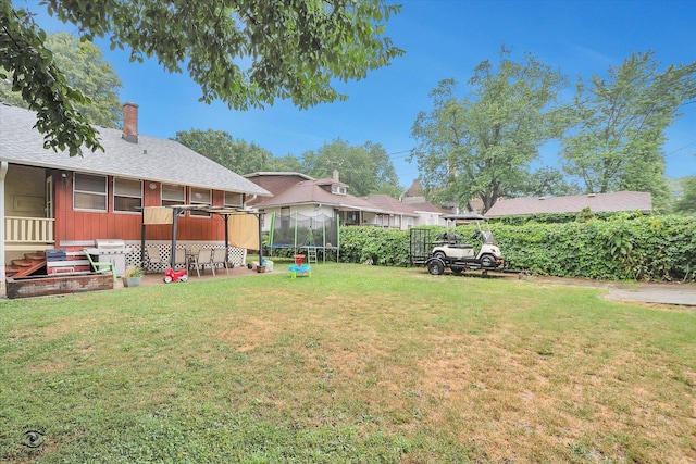 9826 S Walden Pkwy, Chicago, IL 60643 - view of grassy yard with a trampoline