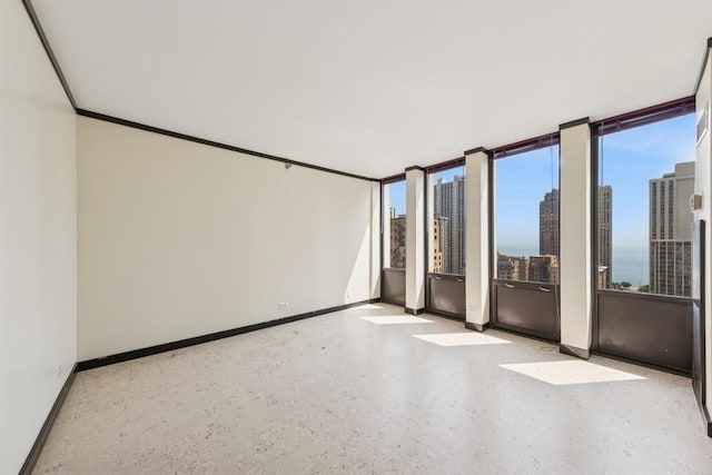 1230 N State Pkwy Unit 17A, Chicago, IL 60610 - unfurnished room with baseboards and a view of city