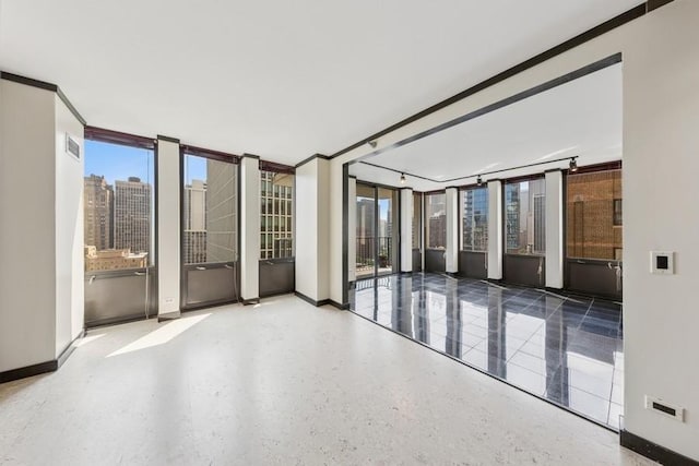 1230 N State Pkwy Unit 17A, Chicago, IL 60610 - spare room with healthy amount of natural light and speckled floor