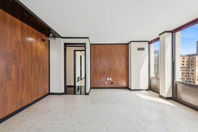 1230 N State Pkwy Unit 17A, Chicago, IL 60610 - spare room featuring baseboards and dark speckled floor