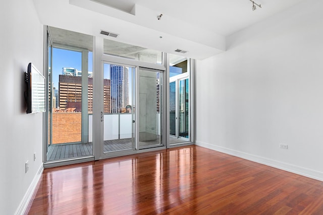 550 N Saint Clair St Unit 2301, Chicago, IL 60611 - spare room featuring wood finished floors and baseboards