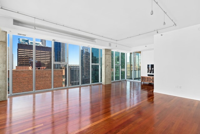 550 N Saint Clair St Unit 2301, Chicago, IL 60611 - unfurnished room featuring wood finished floors and a wall of windows