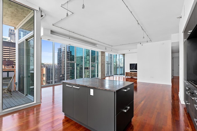 550 N Saint Clair St Unit 2301, Chicago, IL 60611 - kitchen featuring floor to ceiling windows, a kitchen island, dark wood-style floors, and modern cabinets