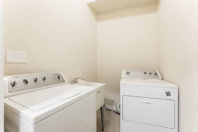 2120 W Grand Ave Unit D, Chicago, IL 60612 - washroom featuring washer and dryer and light tile patterned floors