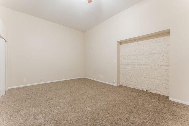 2120 W Grand Ave Unit D, Chicago, IL 60612 - carpeted empty room featuring lofted ceiling and baseboards