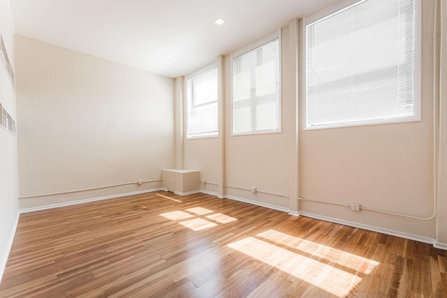 2120 W Grand Ave Unit D, Chicago, IL 60612 - empty room with wood finished floors and baseboards
