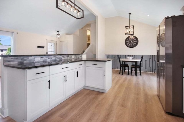 3302 Rustic Ln, Crown Point, IN 46307 - kitchen featuring vaulted ceiling, a chandelier, freestanding refrigerator, light wood-type flooring, and white cabinetry
