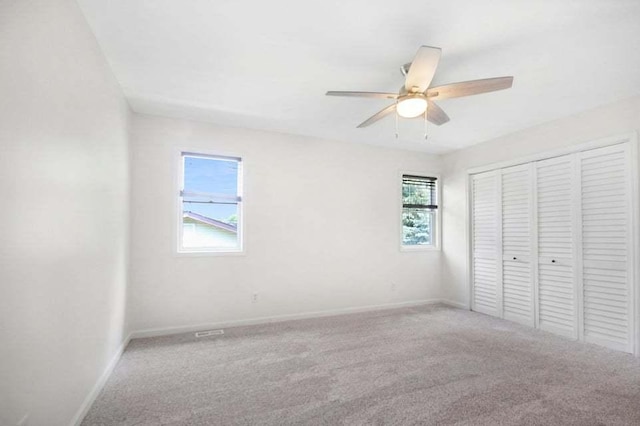 3302 Rustic Ln, Crown Point, IN 46307 - unfurnished bedroom with carpet flooring, a closet, and a ceiling fan
