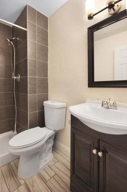 3302 Rustic Ln, Crown Point, IN 46307 - full bathroom with vanity and a tile shower