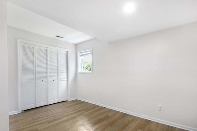 3302 Rustic Ln, Crown Point, IN 46307 - unfurnished bedroom with wood finished floors and a closet