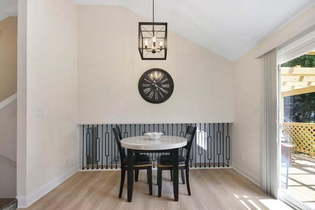 3302 Rustic Ln, Crown Point, IN 46307 - dining space featuring lofted ceiling, wood finished floors, and a chandelier