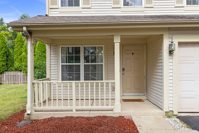 14208 S Napa Cir, Plainfield, IL 60544 - doorway to property with a porch, a garage, and roof with shingles