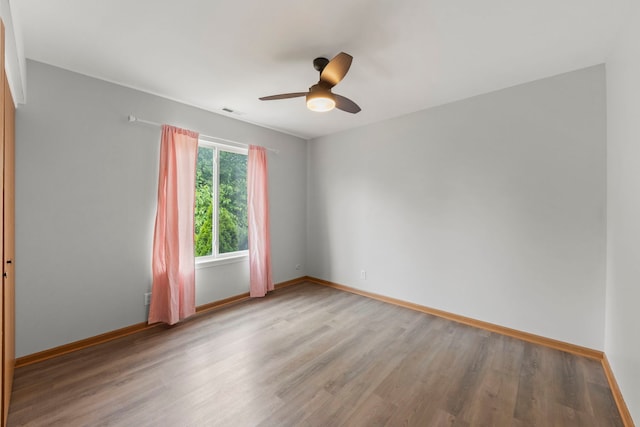 14208 S Napa Cir, Plainfield, IL 60544 - spare room with wood finished floors and a ceiling fan