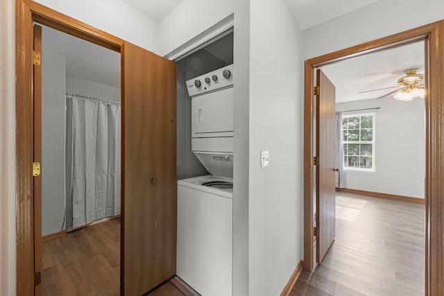 14208 S Napa Cir, Plainfield, IL 60544 - washroom featuring estacked washer and dryer, wood finished floors, and ceiling fan