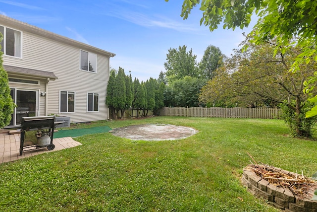 14208 S Napa Cir, Plainfield, IL 60544 - fenced backyard featuring an outdoor fire pit and a patio area
