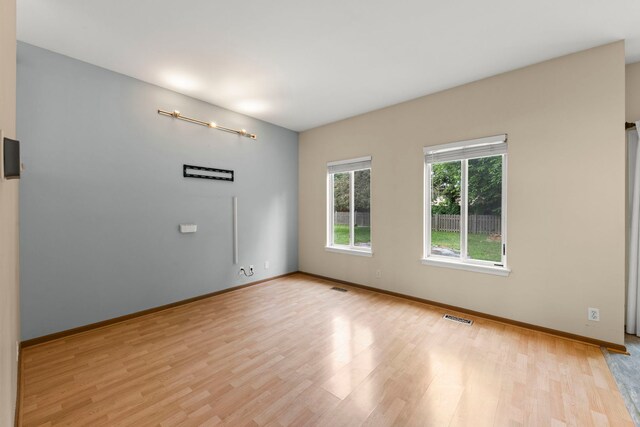 14208 S Napa Cir, Plainfield, IL 60544 - spare room with light wood-style flooring and baseboards