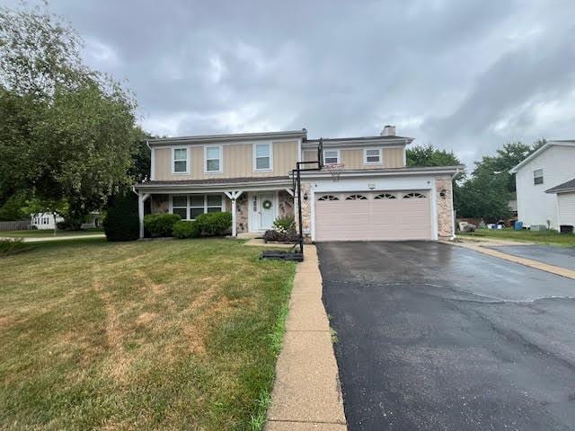 810 Fox Run Ln, Algonquin, IL 60102 - traditional home featuring asphalt driveway, a front lawn, a chimney, a garage, and a porch