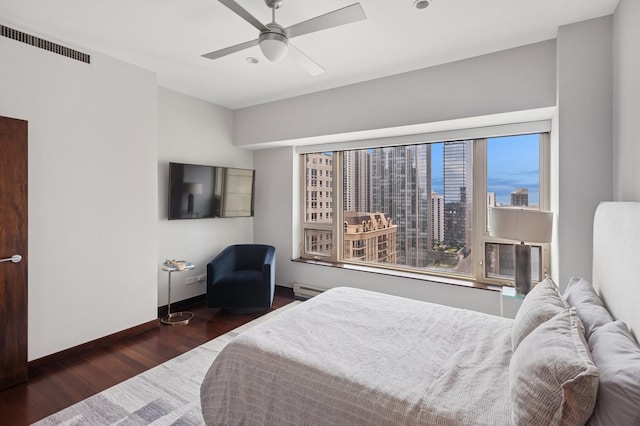 800 N Michigan Ave Unit 2502, Chicago, IL 60611 - bedroom featuring wood finished floors, a ceiling fan, and a baseboard heating unit