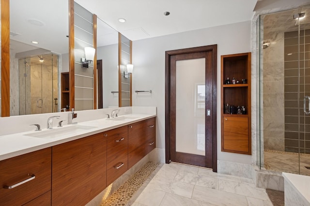 800 N Michigan Ave Unit 2502, Chicago, IL 60611 - bathroom featuring a shower stall, double vanity, and marble look tile flooring