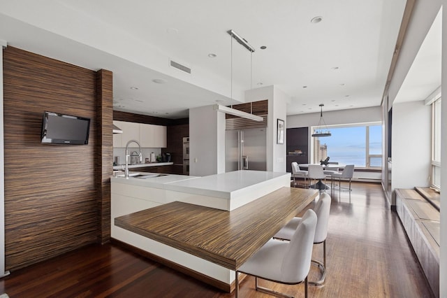800 N Michigan Ave Unit 2502, Chicago, IL 60611 - kitchen with modern cabinets, wood finished floors, light countertops, stainless steel appliances, and recessed lighting