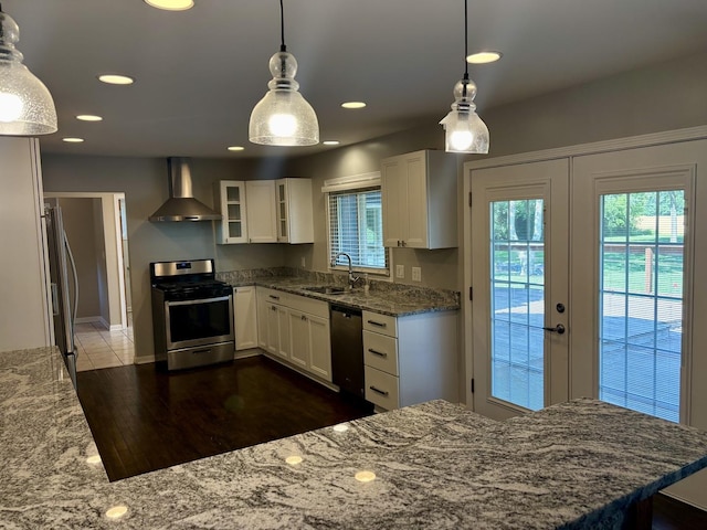 214 Tiverton Rd, Kankakee, IL 60901 - kitchen featuring stainless steel appliances, wall chimney range hood, light stone countertops, white cabinets, and glass insert cabinets