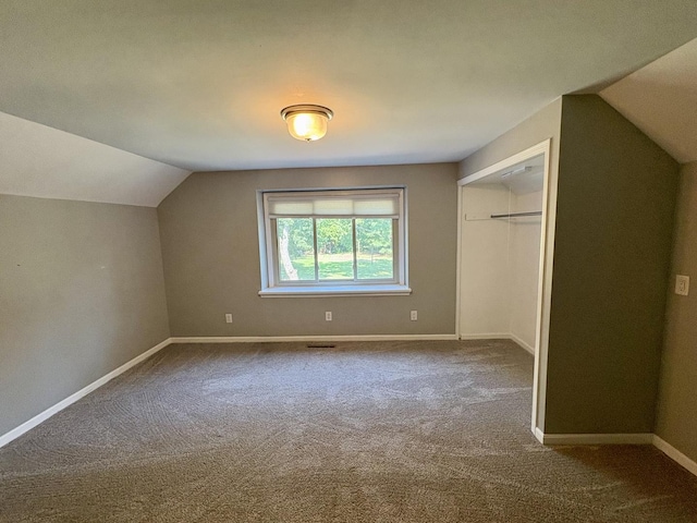 214 Tiverton Rd, Kankakee, IL 60901 - unfurnished bedroom featuring lofted ceiling, carpet floors, and a closet