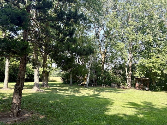 214 Tiverton Rd, Kankakee, IL 60901 - view of grassy yard featuring a storage unit