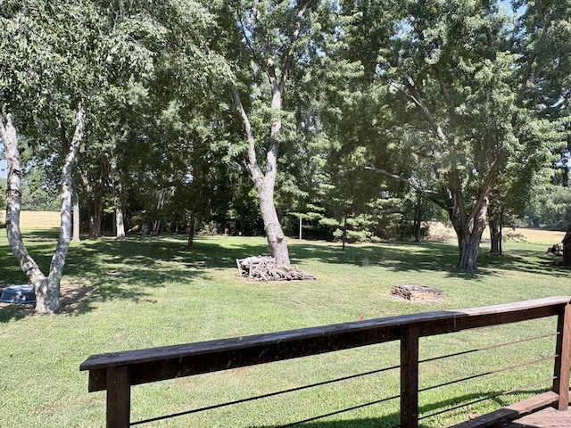 214 Tiverton Rd, Kankakee, IL 60901 - view of green lawn featuring view of wooded area