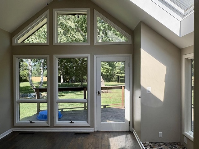 214 Tiverton Rd, Kankakee, IL 60901 - doorway with a skylight, dark wood finished floors, and vaulted ceiling