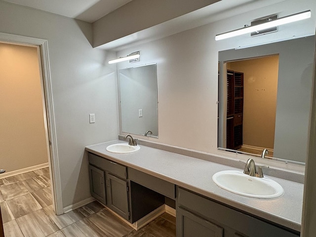214 Tiverton Rd, Kankakee, IL 60901 - bathroom featuring double vanity and baseboards