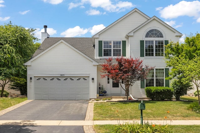 7425 Rosewind Dr, Plainfield, IL 60586 - view of front of house featuring asphalt driveway, a front lawn, a shingled roof, a chimney, and an attached garage