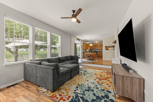 7425 Rosewind Dr, Plainfield, IL 60586 - living room with a ceiling fan and light wood-style floors