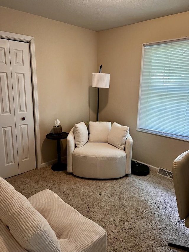 3111/2 W Graham St, Dixon, IL 61021 - carpeted living area featuring baseboards