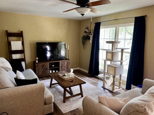 3111/2 W Graham St, Dixon, IL 61021 - living area featuring a textured ceiling, wood finished floors, and ceiling fan