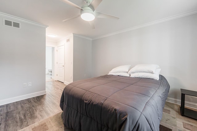 2182 Waterbury Ln E Unit 2182, Sycamore, IL 60178 - bedroom with crown molding, wood finished floors, ceiling fan, and ensuite bathroom