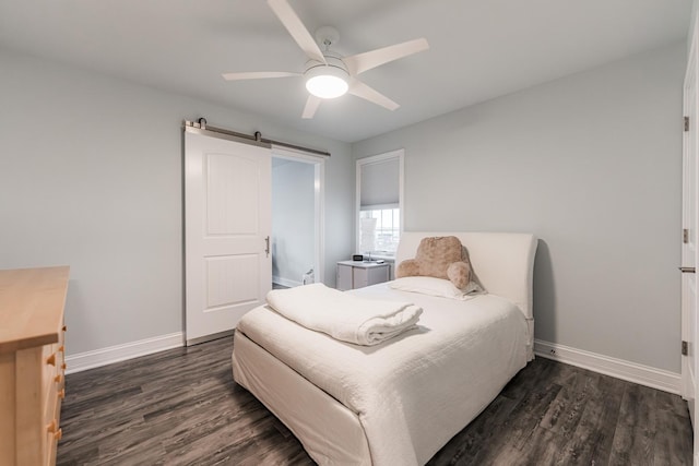 2182 Waterbury Ln E Unit 2182, Sycamore, IL 60178 - bedroom with dark wood finished floors, a barn door, and ceiling fan