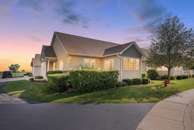 2182 Waterbury Ln E Unit 2182, Sycamore, IL 60178 - view of front of home with a lawn and a shingled roof