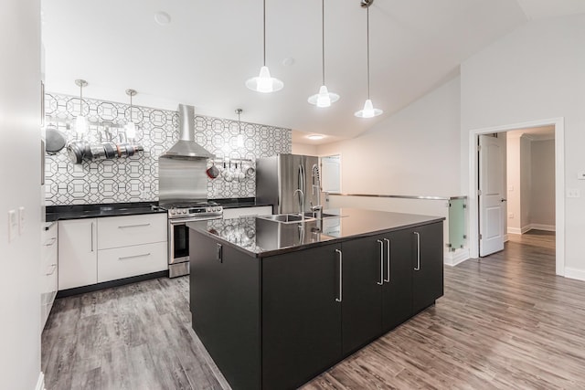 2182 Waterbury Ln E Unit 2182, Sycamore, IL 60178 - kitchen with stainless steel appliances, wall chimney range hood, lofted ceiling, dark countertops, and modern cabinets