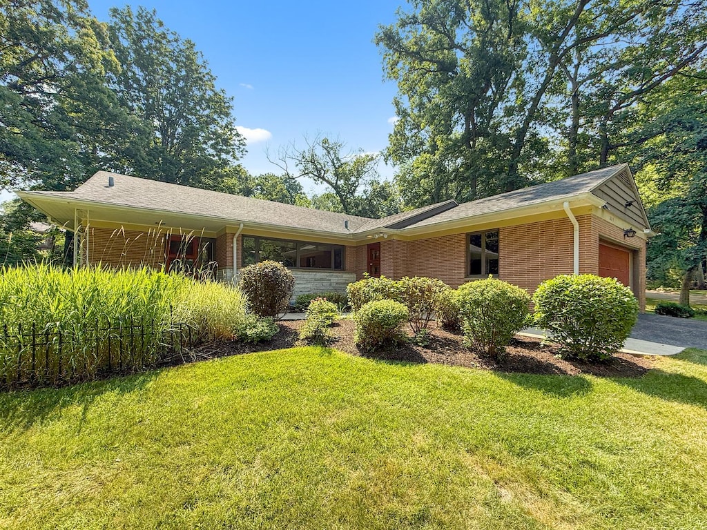 2615 E Chickadee Trl, Rockford, IL 61107 - ranch-style house with a garage, a front yard, and brick siding
