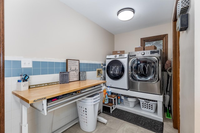 2519 Cherie Ln, Ottawa, IL 61350 - laundry room featuring separate washer and dryer, tile walls, and light tile patterned floors