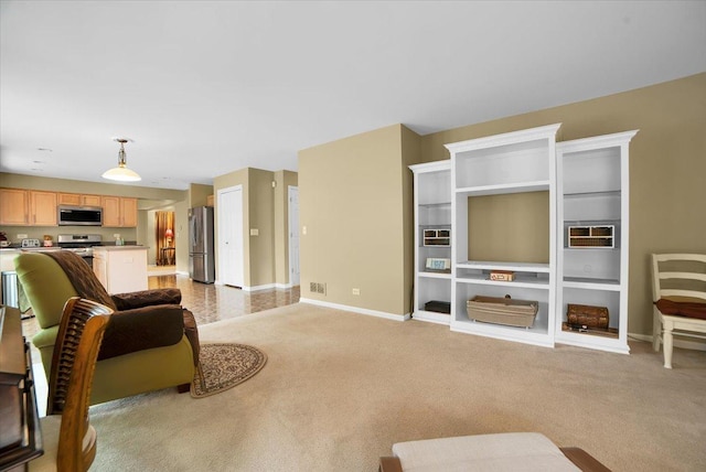 157 Concord Dr, Oswego, IL 60543 - living area featuring baseboards and light carpet