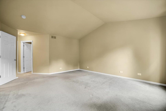 157 Concord Dr, Oswego, IL 60543 - empty room with light colored carpet, vaulted ceiling, and a smoke detector