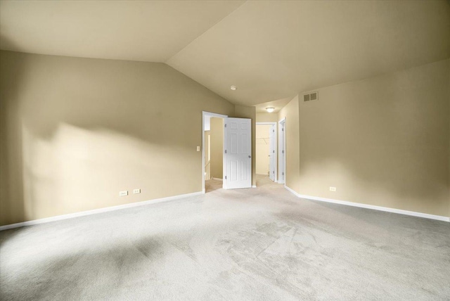 157 Concord Dr, Oswego, IL 60543 - carpeted spare room featuring vaulted ceiling and baseboards